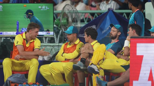 Cameron Green () and Alex Carey (C) look on from the sidelines during Australia’s defeat to Getty Images)