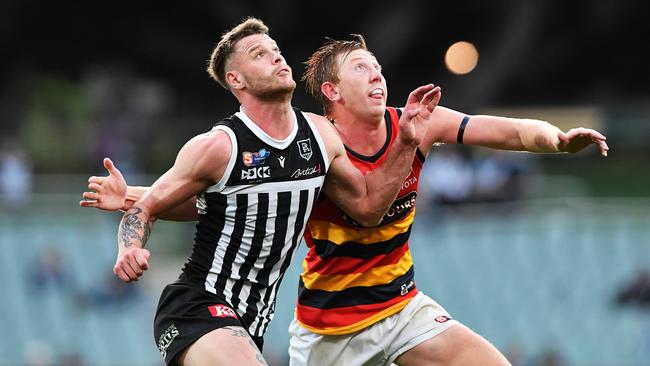 Port Adelaide’s Pete Ladhams and Crow Kieran Strachan in the SANFL Showdown. Picture: Mark Brake/Getty Images