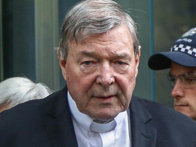 FILE - In this May 2, 2018, file photo, Cardinal George Pell, the most senior Catholic cleric to face sex charges, leaves court in Melbourne, Australia. Pell was sentenced in an Australian court on Wednesday, March 13, 2019 to 6 years in prison for molesting two choirboys in a Melbourne cathedral more than 20 years ago.  (AP Photo/Asanka Brendon Ratnayake, File)