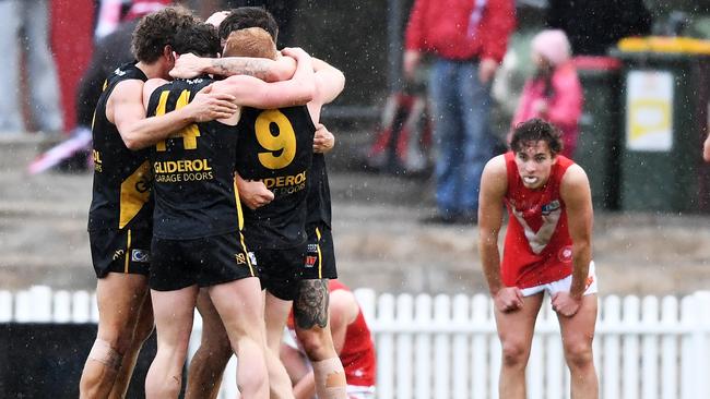 Glenelg celebrate its victory over North Adelaide at Prospect Oval in round 17 last year. Picture: Mark Brake/AAP