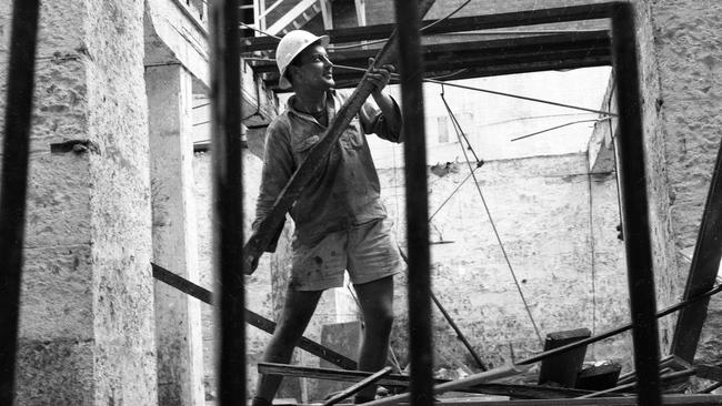 Demolition workers preparing the site for the development of te Edison Telephone Exchange building. Picture: The Courier-Mail Photo Archive.