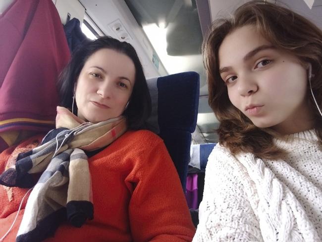 Sofia Shamanska and her mother Olena on the flight from Dubai to Sydney. They first caught a train from Kyiv to Warsaw, then Warsaw to Dubai and then onto Sydney.