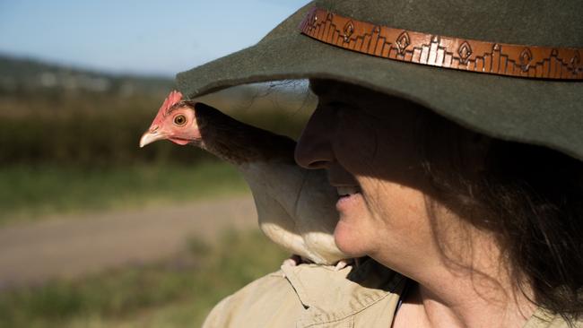 Wendy Tan and her social media sensation CHICKEN. A rescue pet that has ended up travelling Australia with her. Recently they have taken advantage of storm season as STORM CHICKEN. Picture: Christine Schindler