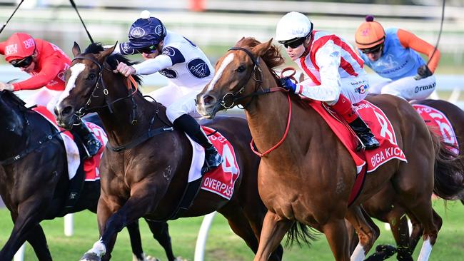 Hot favourite Giga Kick (right) wins the Doomben 10,000 from Overpass. Picture: Grant-Peters-Trackside Photography