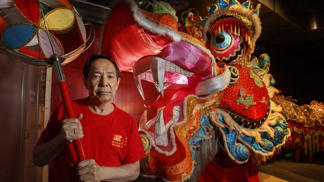 Mark Wang with the 45m-long dragon at the Museum of Chinese Australian. Picture: David Geraghty