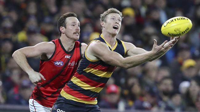 Adelaide’s intercept king Alex Keath, pictured marking in front of Bomber Mitch Brown, will miss a third week through injury. Picture SARAH REED