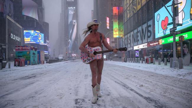 The Naked Cowboy struts his stuff in Times Square on Sunday. Picture: AFP