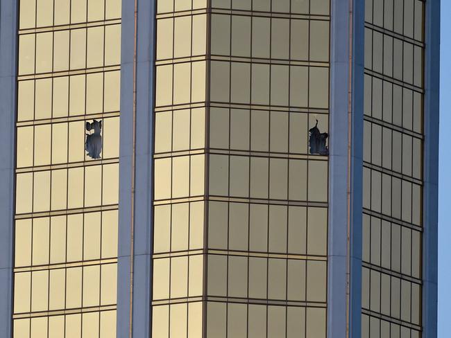 Broken windows on the 32nd floor of the Mandalay Bay Resort and Casino after a lone gunman opened fire on the Route 91 Harvest country music festival. Picture: David Becker/Getty Images/AFP