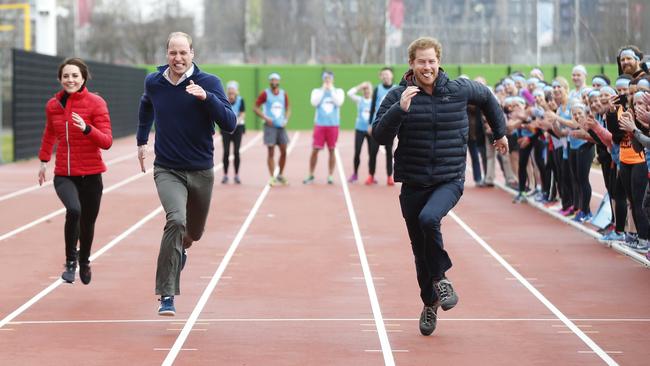 Kate Middleton, Prince William and Prince Harry race during a Marathon Training Day with Team Heads Together in 2017. Picture: Alastair Grant/Getty