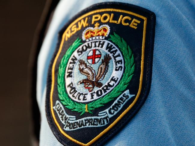 DAILY TELEGRAPH. Embed with police on Operation Amarok regional domestic violence response on the NSW Mid North Coast. In this picture, police conduct an AVO compliance check at an address in Kempsey. GENERIC police badge patch. Wednesday 15/05/2024. Picture by Max Mason-Hubers Police knock on the door of a Kempsey home in order to do an compliance check. No one is home and we leave.