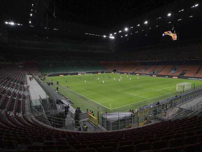 A general view inside the empty San Siro stadium in Milan, Italy during the Europa League round of 32 second leg soccer match between Inter Milan and Ludogorets on Thursday Feb. 27, 2020. Inter beat Ludogorets 2-1 in an empty stadium as a precaution because of the virus outbreak in Italy. (Emilio Andreoli, UEFA via AP )