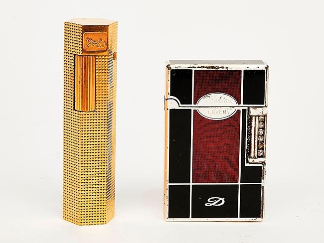 Auction of Bob Hawke & Blanche d'Alpuget Mementos Curiosities Art and Design: Celine Gold Plated Lighter together with another lighter, and two silver match cases (4). Picture: Supplied