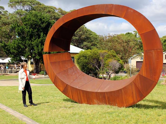 Harbour Trust chief executive Mary Darwell with the last year’s Sculpture by the Sea Bondi winning work, Orb by David Ball of Mittagong, installed at Mosman.