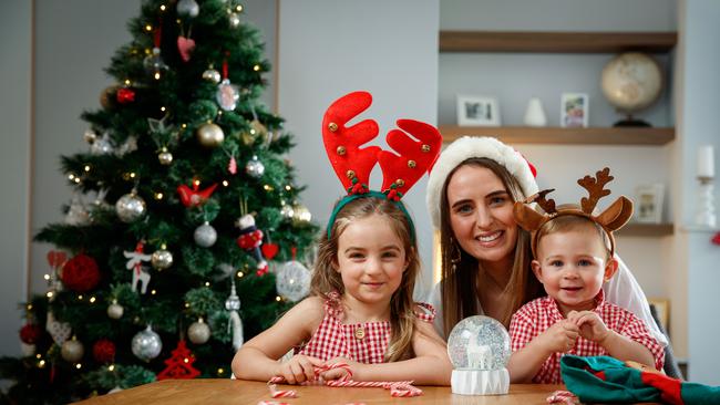 Nina Calabrese and her children Eva and Luca are looking forward to having gatherings of up to 50 people in a private house. Picture: Matt Turner.