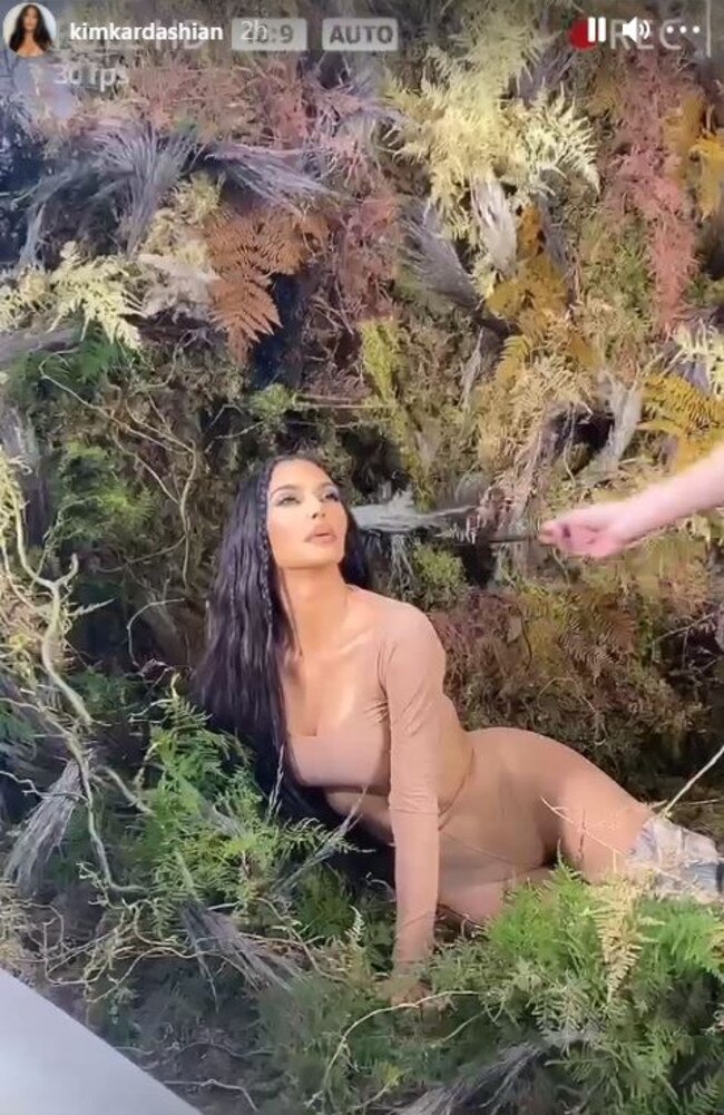 The mother-of-four shared behind-the-scenes footage of her camo-inspired photo shoot. Picture: Instagram/Kimkardashian