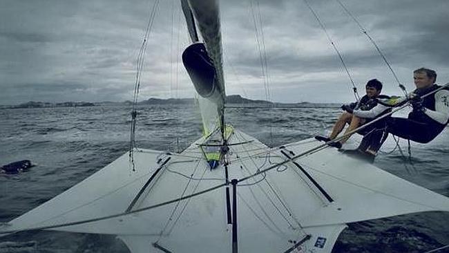 Australian Nathan Outteridge sailing past a dead dog in Rio.