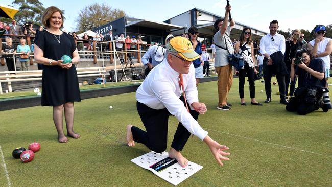 Scott Morrison and Liberal member for Corangamite Sarah Henderson play bowls at the Torquay Bowls Club near Geelong in April. Picture: Mick Tsikas/AAP