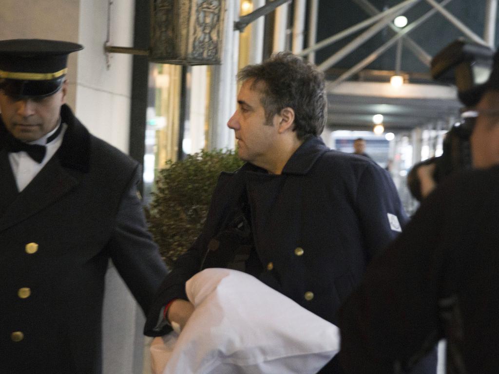 Democrats are calling for an investigation into the allegations Mr Trump ordered lawyer Michael Cohen, pictured arriving at his New York home on Thursday, to cover up information relating to a possible Moscow real estate deal. Picture: AP Photo/Kevin Hagen 