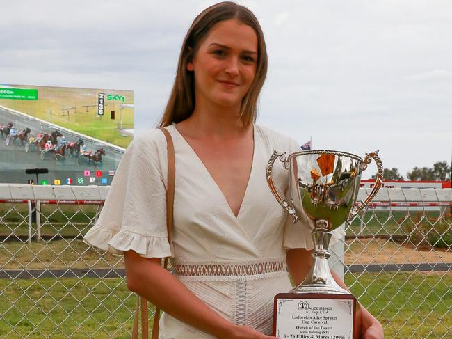 Alice Springs Cup-winning jockey Jade Hampson with her trophy at the Alice Springs Cup at Pioneer Park. Picture: Nikki Westover