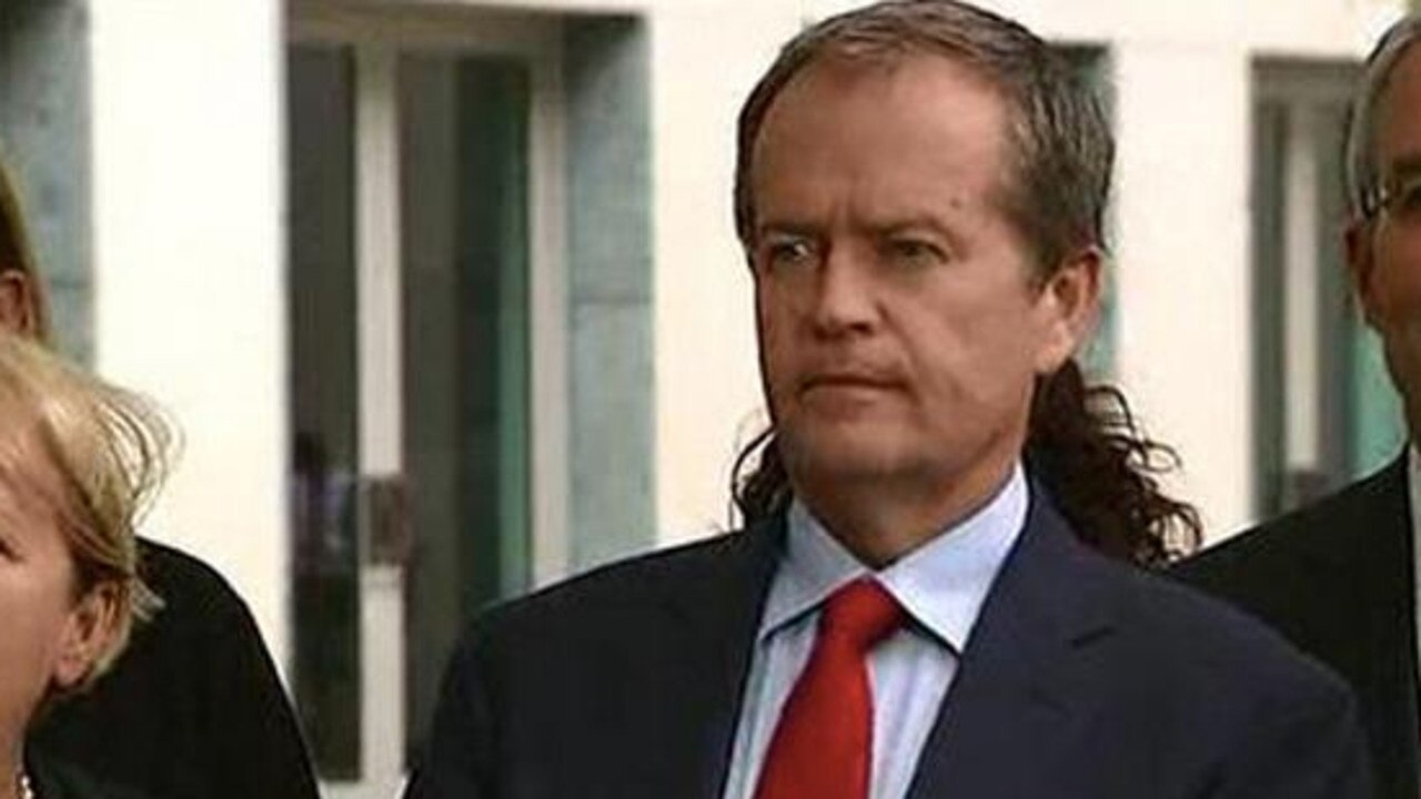 Bill Shorten is given a mullet at a press conference thanks to Amanda Rishworth.