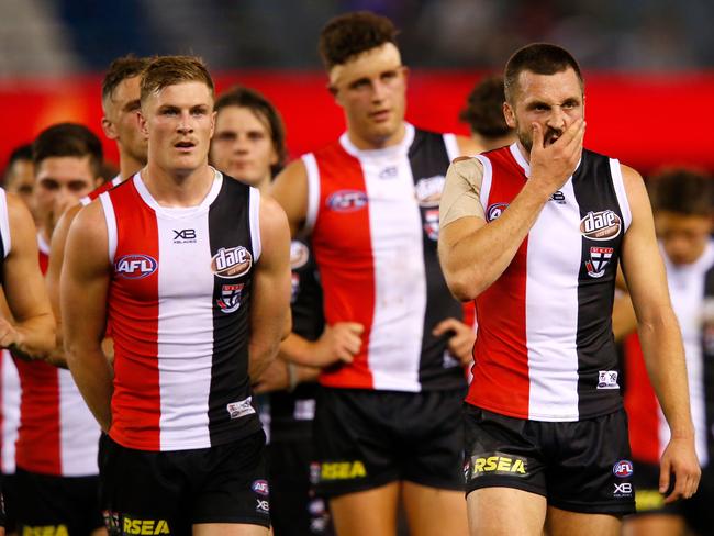 MELBOURNE, VICTORIA - MAY 06:  A dejected Jarryn Geary of the Saints leads his team off the ground after the round seven AFL match between St Kilda Saints and the Melbourne Demons at Etihad Stadium on May 6, 2018 in Melbourne, Australia.  (Photo by Darrian Traynor/AFL Media/Getty Images)