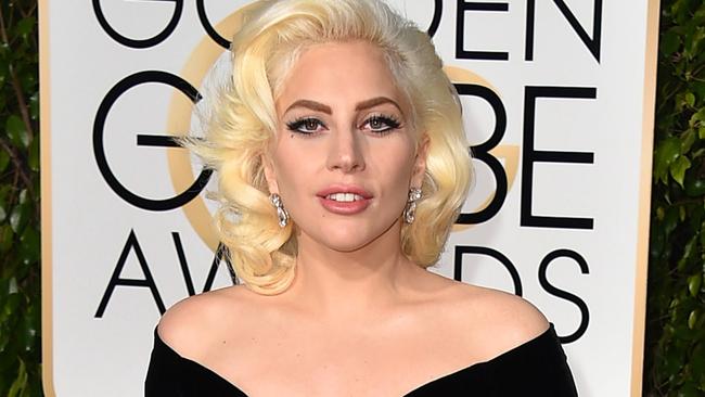 FILE - In this Jan. 10, 2016 file photo, Lady Gaga arrives at the 73rd annual Golden Globe Awards in Beverly Hills, Calif. Gaga’s "Til It Happens to You," the song she wrote with Diane Warren for the sexual assault documentary, "The Hunting Ground," was nominated for an Oscar for best original song on Thursday, Jan. 14, 2016. (Photo by Jordan Strauss/Invision/AP, FIle)