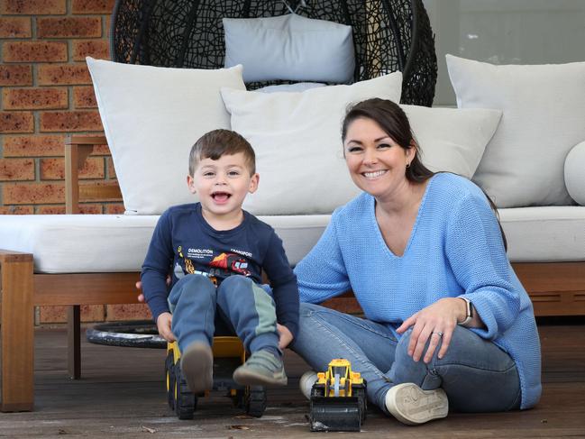 Natalie Flores, with her three-year-old son Rafael, elected to care for her own children due to the costs of childcare. Picture: Andrew Tauber