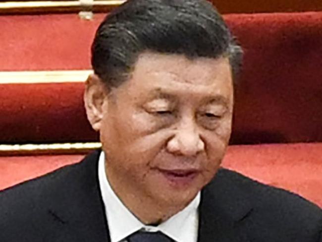 China's President Xi Jinping sings the national anthem during the closing session of the National Peopleâs Congress (NPC) at the Great Hall of the People in Beijing on March 11, 2022. (Photo by Leo RAMIREZ / AFP)