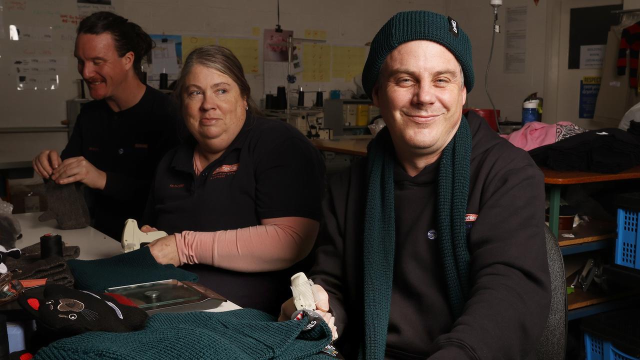 Mathew Midgley sewing assistant at Tas Textiles tagging some of the beanies. Beanies and jumpers for the Tasmania Devils are being made in Tasmania at Tas Textiles in Glenorchy. Picture: Nikki Davis-Jones