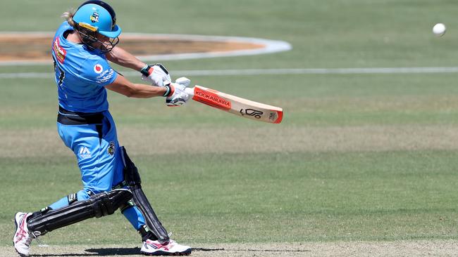 One of five: Strikers all-rounder Sophie Devine gets sweet contact with the ball and sends it over the fence during an exceptional unbeaten innings of 85. Picture: James Elsby/Getty Images