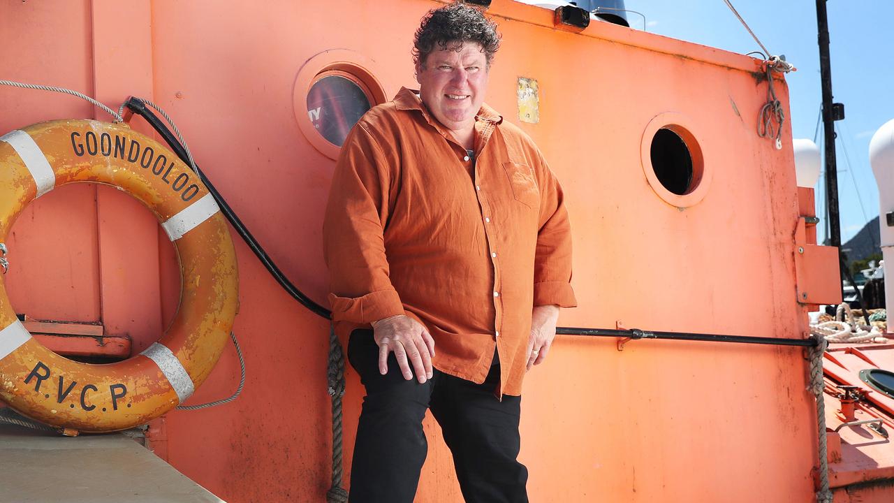 Real estate agent Craig Bellgrove with wooden boat Goondooloo that has been salvaged from the Tamar River to be restored in Hobart. Picture: Nikki Davis-Jones