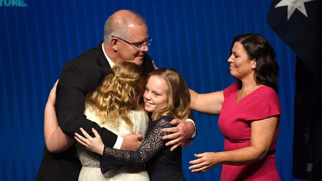 Scott Morrison with his daughters Abbey and Lily, and wife Jenny after speaking at the Coalition’s campaign launch in Melbourne yesterday. Picture: AFP 