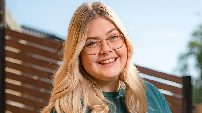 Dana Thomson, 25, (with pet bird Atticus) says she had a "quarter life crisis" when she first finished university three years ago - unsure which direction she wanted her career to take. At home in Melbournes south eastern suburbs. Picture: Jason Edwards