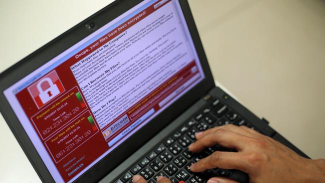 A programmer demonstrates a ransomware cyber attack in Taiwan in 2017.