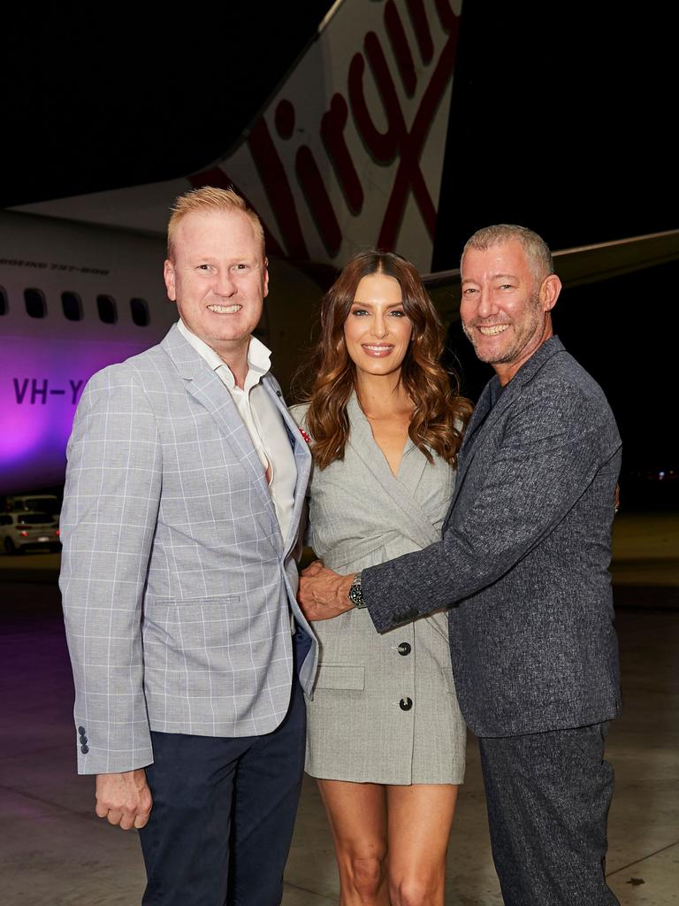 David Lutteral, Erin Holland and Grant Pearce at the launch of Virgin Australia's new business-class menu in the Virgin hangar at Brisbane Airport. Picture: Carly Ravenhall