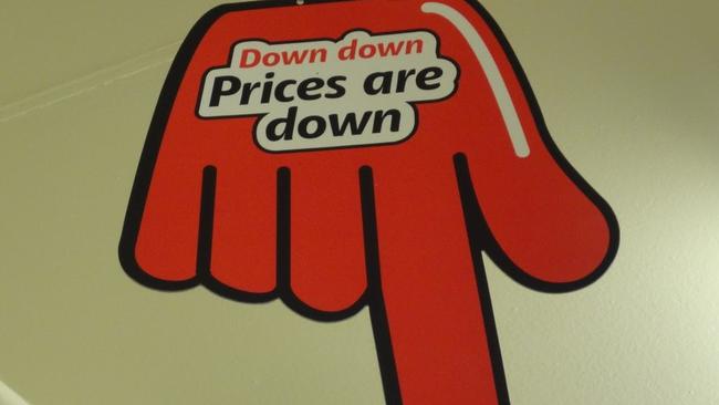 Traditional ad campaigns, such as Coles’ famous “down, down, prices are down” hand, are crucial in the selling process. Picture: Coles