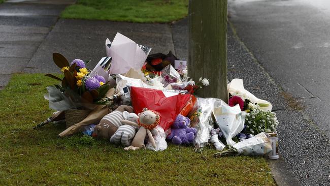 Pictured are flowers laid across the road from the home in Lalor Park. Picture: Richard Dobson