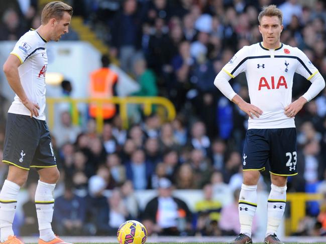 Tottenham Hotspur's English striker Harry Kane (L) and Danish midfielder Christian Eriksen (R) react at the restart after Stoke City scored their second goal during the English Premier League football match between Tottenham Hotspur and Stoke City at White Hart Lane in north London on November 9, 2014. AFP PHOTO / OLLY GREENWOOD RESTRICTED TO EDITORIAL USE. No use with unauthorized audio, video, data, fixture lists, club/league logos or “live” services. Online in-match use limited to 45 images, no video emulation. No use in betting, games or single club/league/player publications