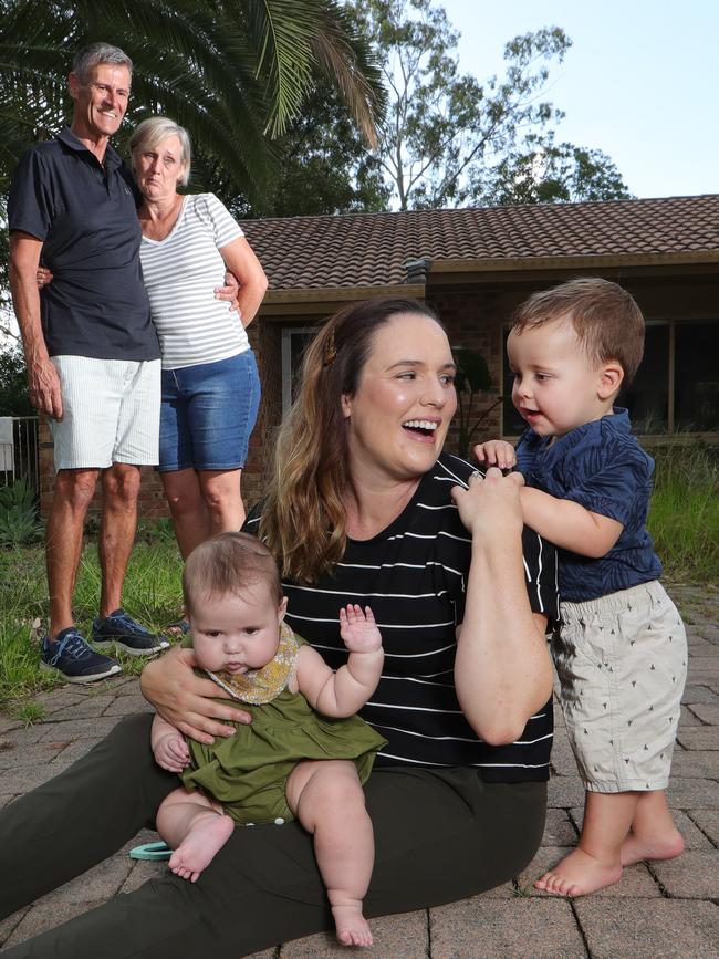 Kylie Carmody with her children Olive and Abel, who she is leaving with parents Neil Thorogood and Ruth Lund as she moves to Brisbane to join her husband in the fight against COVID-19. Picture Glenn Hampson