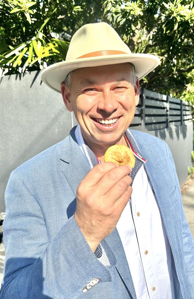 Adam Giles with a pie. Picture: Des Houghton