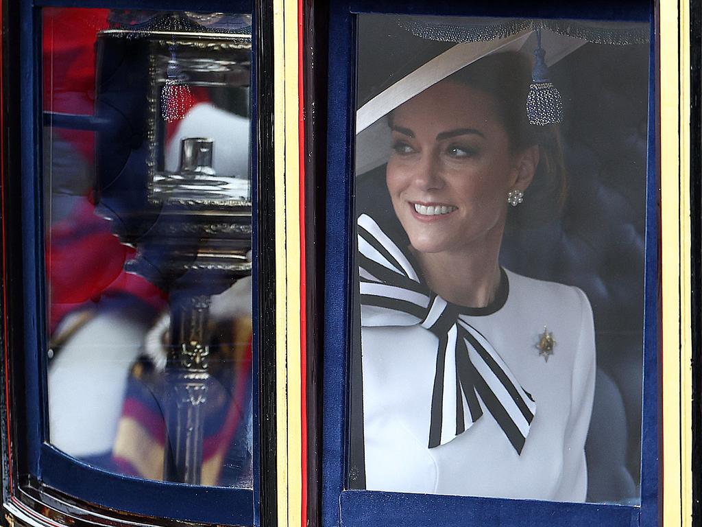 Catherine, Princess of Wales, smiles inside the Glass State Coach on her way to Horse Guards Parade for the King's Birthday Parade "Trooping the Colour" in London on June 15. Picture: Henry Nicholls/AFP