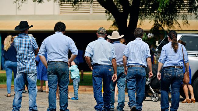 Family and friends arrive at Casuarina Street primary school for Dolly Everett's memorial service in Katherine, Northern Territory.