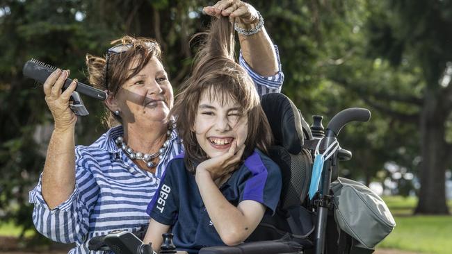 Angus Hopkins is taking part in the World’s Greatest. Pictured with his mother Jody Ezzy. Picture: Nev Madsen.