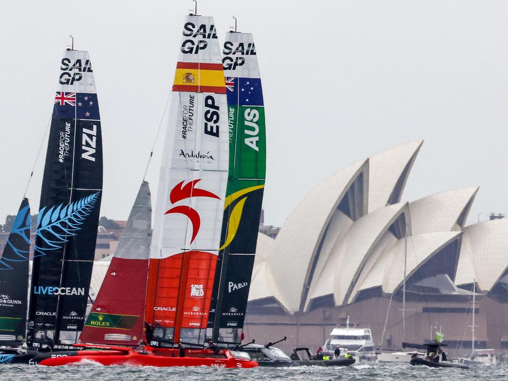 The crews of Team New Zealand, Team Spain and Team Australia sail in front of the Sydney Opera House during the Sail Grand Prix event on Sydney Harbour. Picture: David Gray/AFP