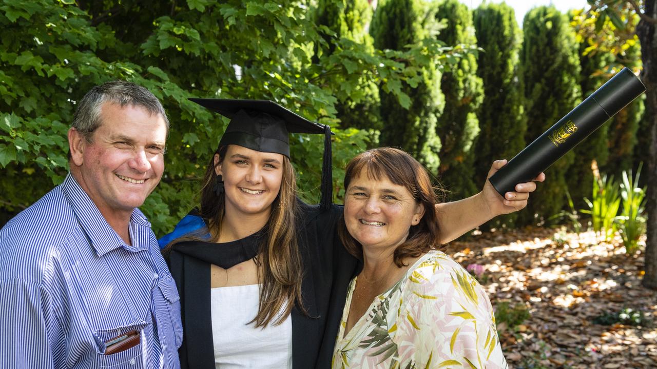 Bachelor of Sport and Exercise Science graduate Emily Hoffmann with parents Robert and Nacole Hoffmann at the UniSQ graduation ceremony at Empire Theatres, Wednesday, December 14, 2022.