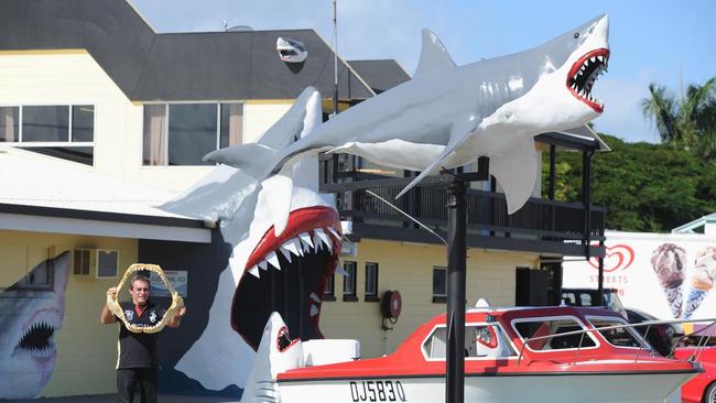 Vic Hislop in 2013 with a set of jaws from a 5.3m tiger shark caught off Point Vernon in 2012. Pictured outside his shark show on the Esplanade at Urangan. Photo: Alistair Brightman / Fraser Coast Chronicle