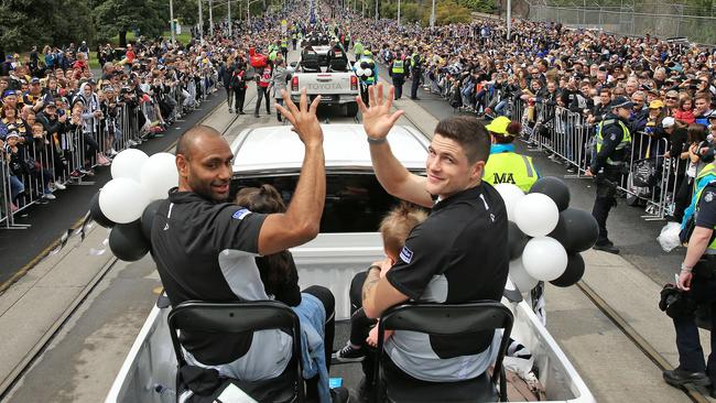 Travis Varcoe and Jack Crisp during the 2018 AFL Grand Final parade. Picture: Mark Stewart