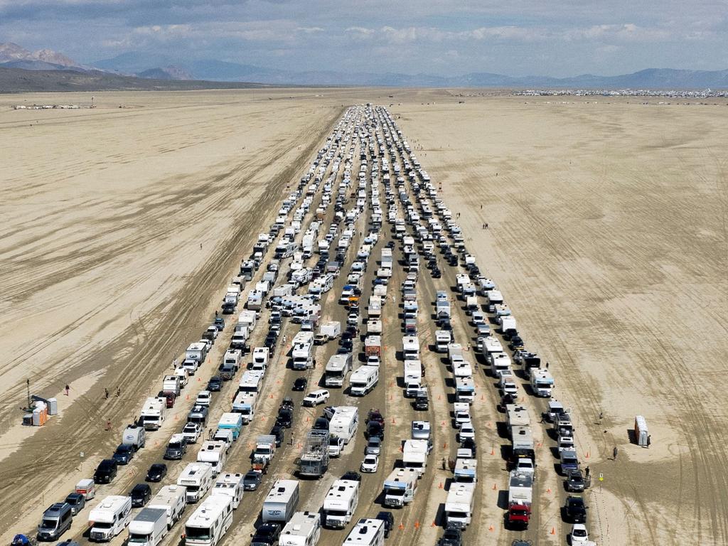 Vehicles are seen departing the Burning Man festival in Black Rock City, Nevada. Picture: Reuters