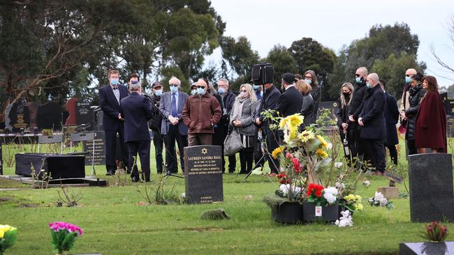 Mourners graveside in Springvale. Picture: David Caird