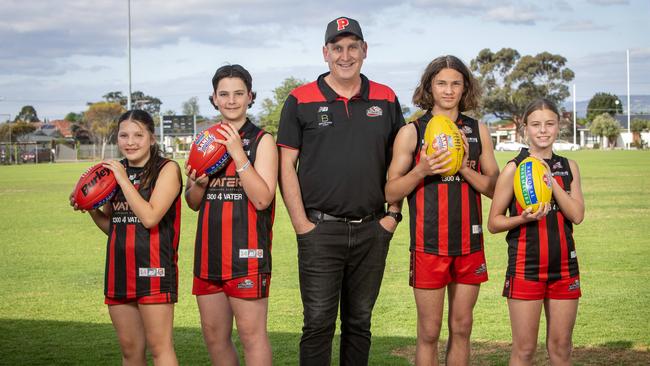 Plympton Football Club junior director Jamie Morgan with players L to R Ada-Mae 12yrs, Angus 14yrs, Harper 15yrs, Jemima 13yrs. They have won the SANFL's Junior Club of the Year award for 2022. Picture: Emma Brasier